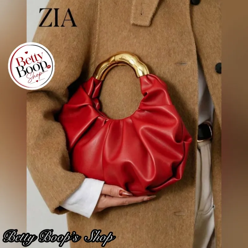 Bolso de mano rojo con mango dorado