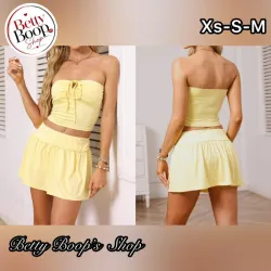 Conjunto amarillo pastel de top strapless y falda