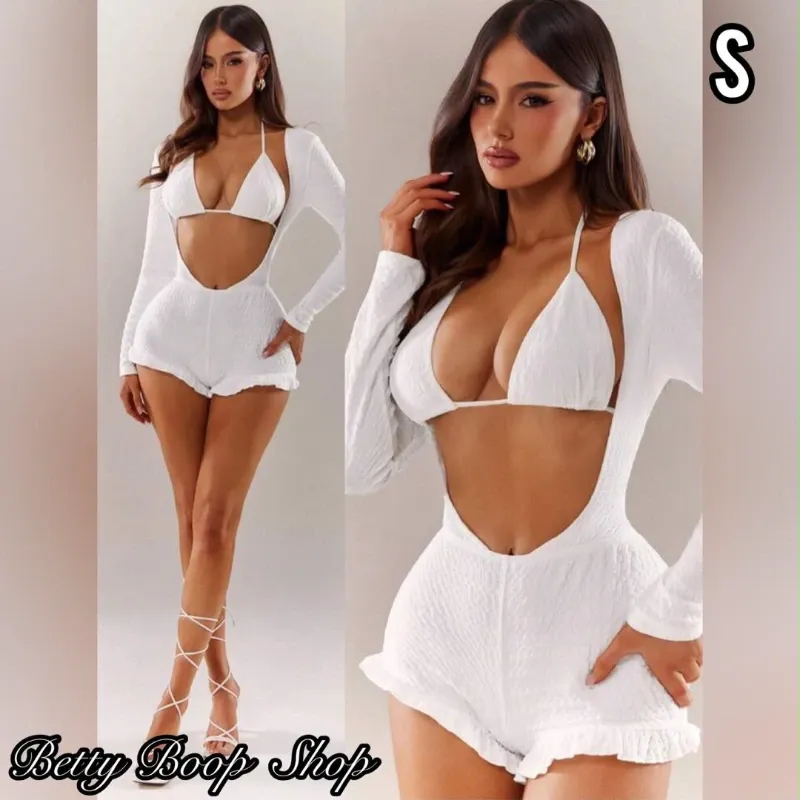 Conjunto blanco de top y pareo en forma de enterizo