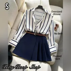 Conjunto de camisa a rayas y falda azul oscuro