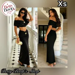 Conjunto negro con broches dorados de conchas
