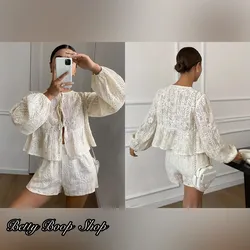 Conjunto tejido de blusa de mangas y short