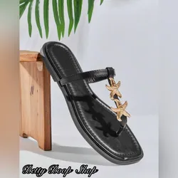 Sandalias negras con estrellas doradas
