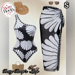 Trusa negra con estampado de conchas blancas y pareo