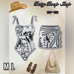 Truza blanca con estampado negro y saya corta pareo