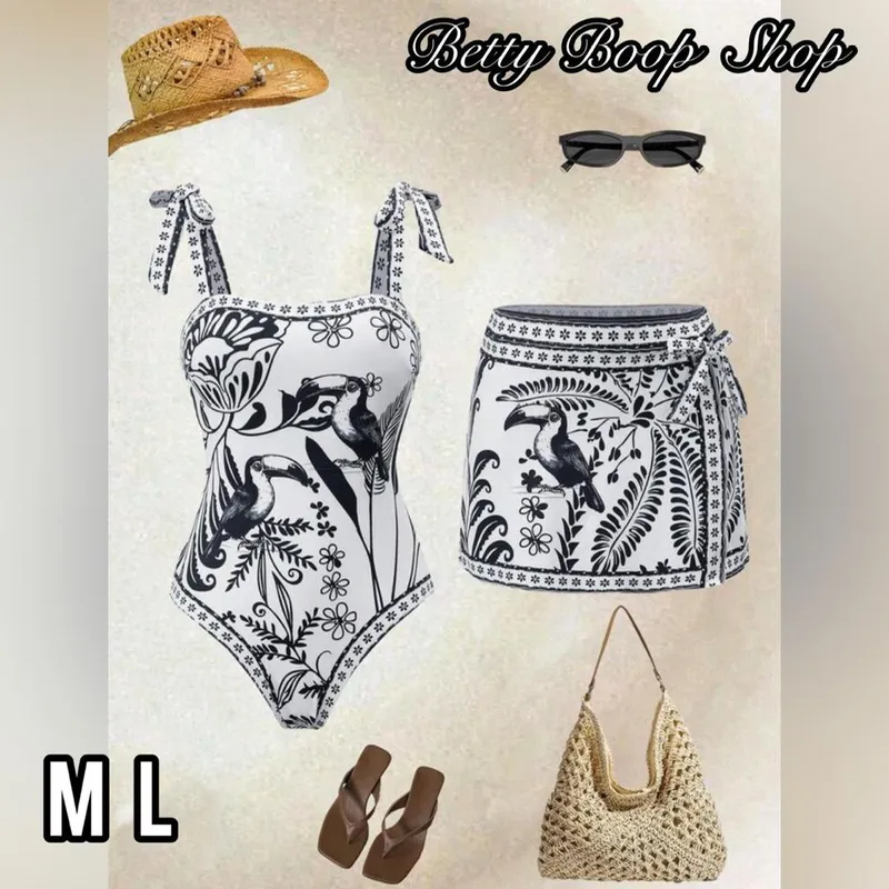 Truza blanca con estampado negro y saya corta pareo