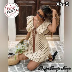 Vestido amarillo pastel con estampado polka dot marrón