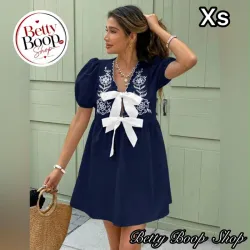 Vestido azul marino con lazos blancos