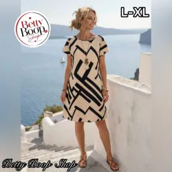 Vestido beige con estampado asimétrico en negro, corte recto y fresco