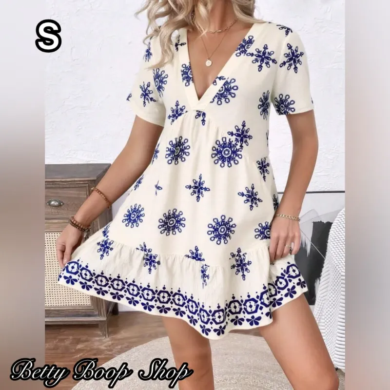 Vestido blanco estampado con flores azules y mangas