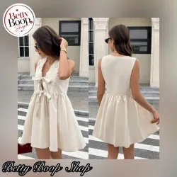 Vestido blanco hueso con lazos corte recto y fresco