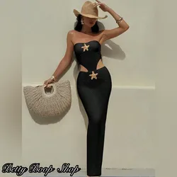 Vestido body negro pegado con estrella dorada