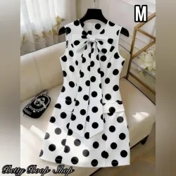 Vestido de lunares con adorno de lazo