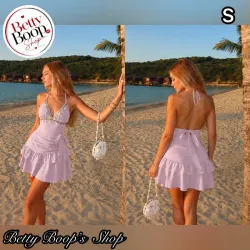 Vestido rosa con caracoles, lazo y vuelos
