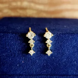 Destello dorado con circonia 