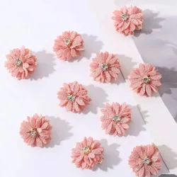 Horquillas para el cabello con flores de tela rosadas