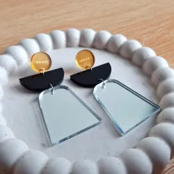 M circulo dorado, negro, plateado