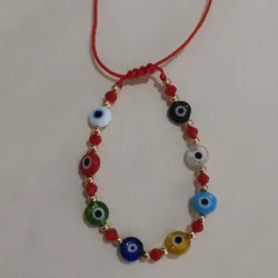 Pulsera de swarovski y 8 ojos turcos