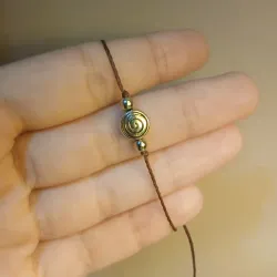 Pulso de hilo con espiral de metal