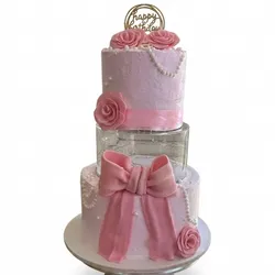 Cake de 2 pisos con piso de aclirico y decoración comestible