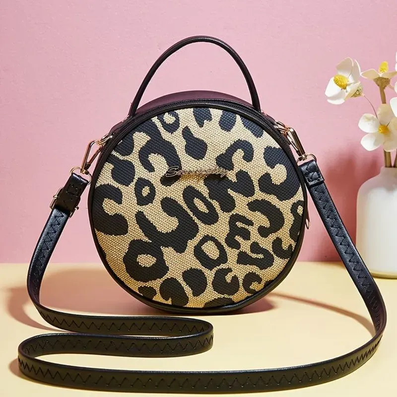 Bolso redondo animal print 