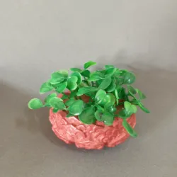 Búcaro bajito con follajes verde
