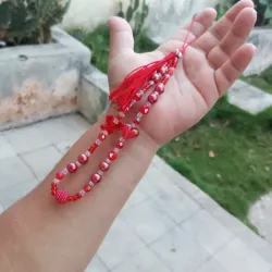 Colgante rojo con borla