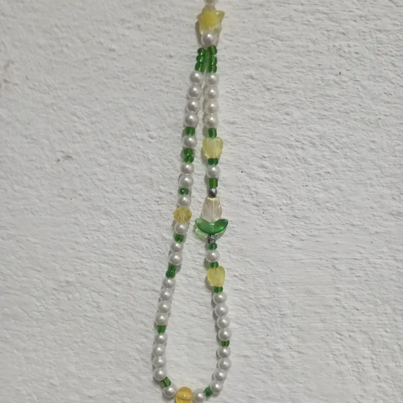 Colgante verde y amarillo con flor de cristal 