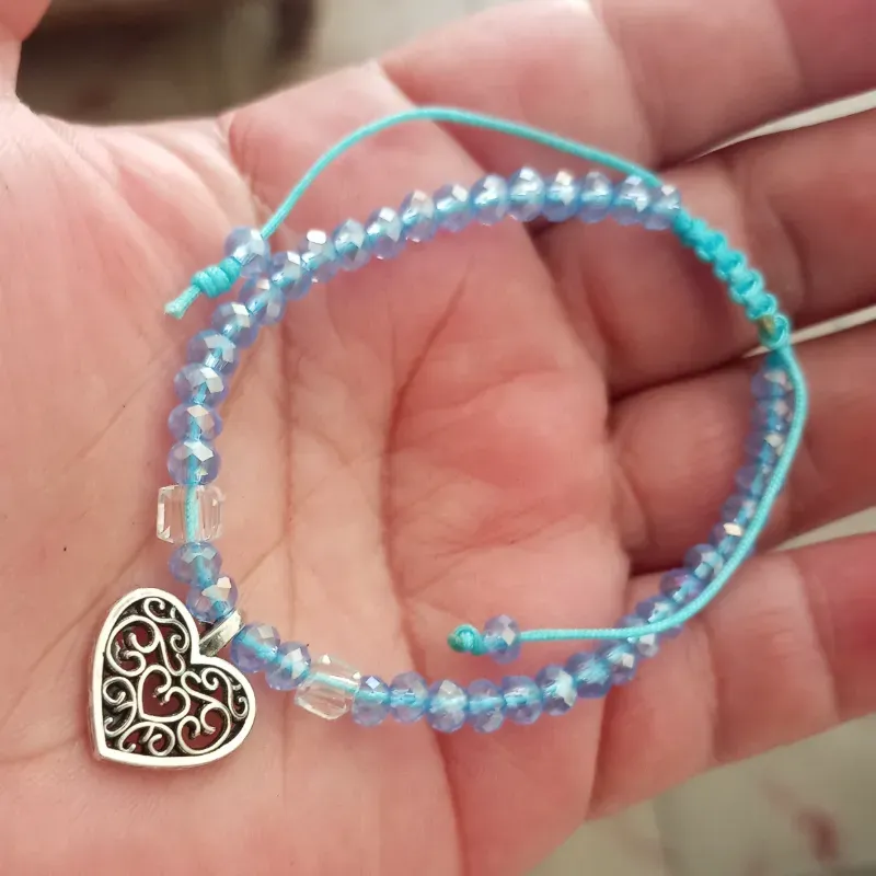 Pulso swaroski azul y corazón tibetano 