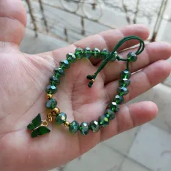 Pulso de swaroski verde y mariposa 