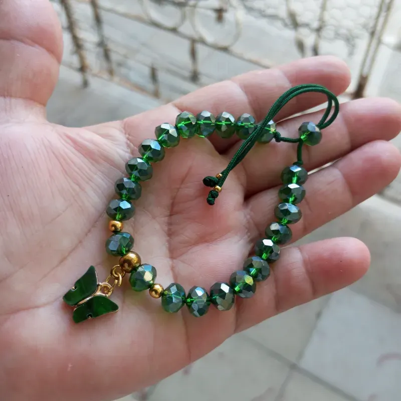 Pulso de swaroski verde y mariposa 