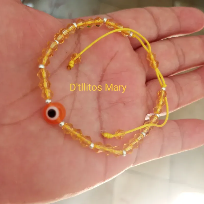 Pulso swaroski y Ojo naranja 