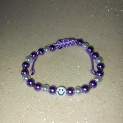 Pulso violeta con emojis 