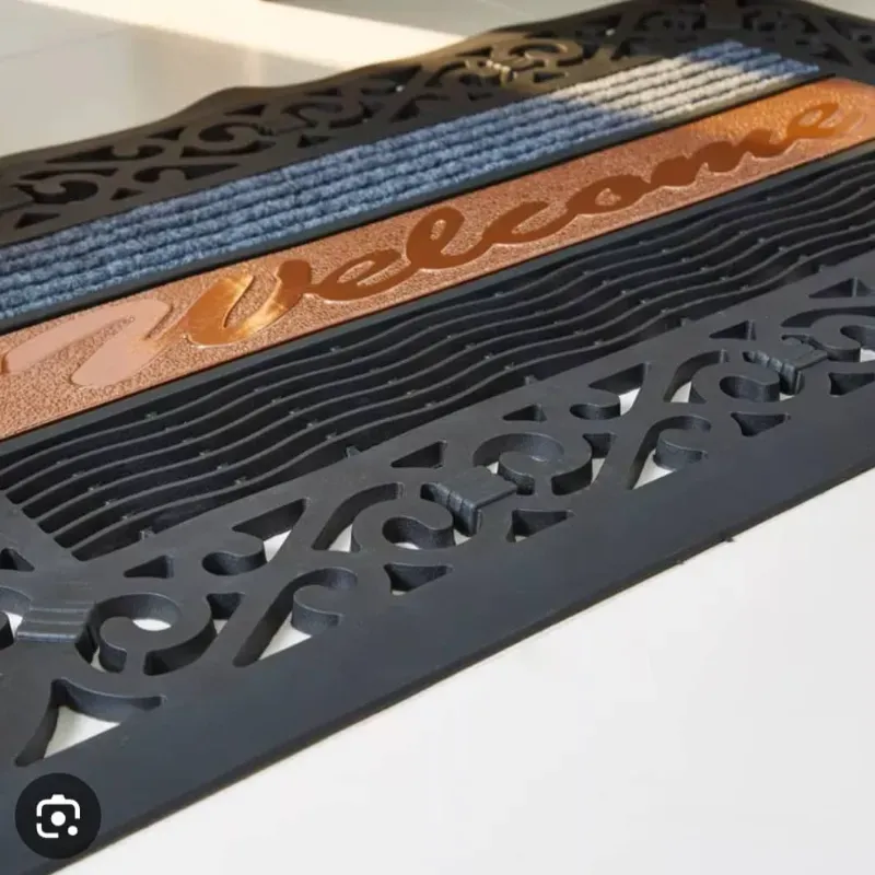 Alfombras de entrada engomadas