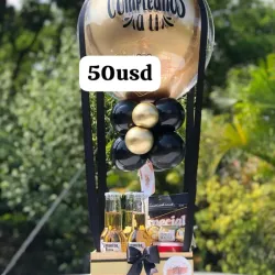 Caja con globos , cerveza , bombones originales y confituras