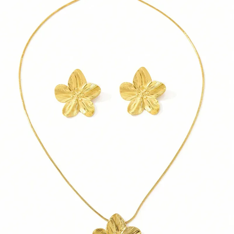 Juego de collar y aretes de flores dorados