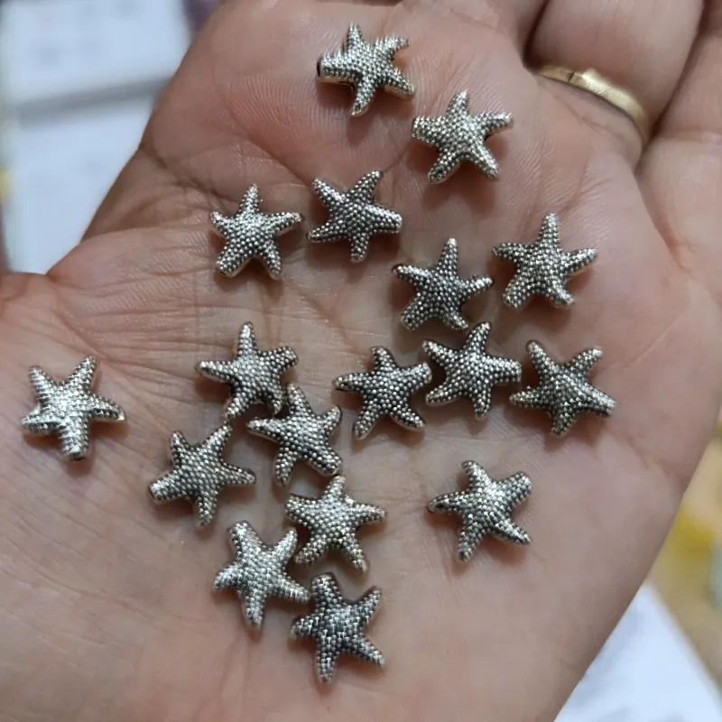Conector plateado en forma de ⭐ estrella de mar