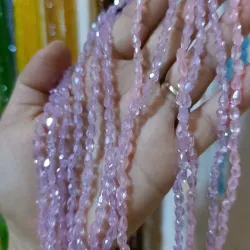 Cristal en forma de 💧 color rosado y malva