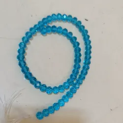 Cristal tipo dona de 8mm color azul claro 