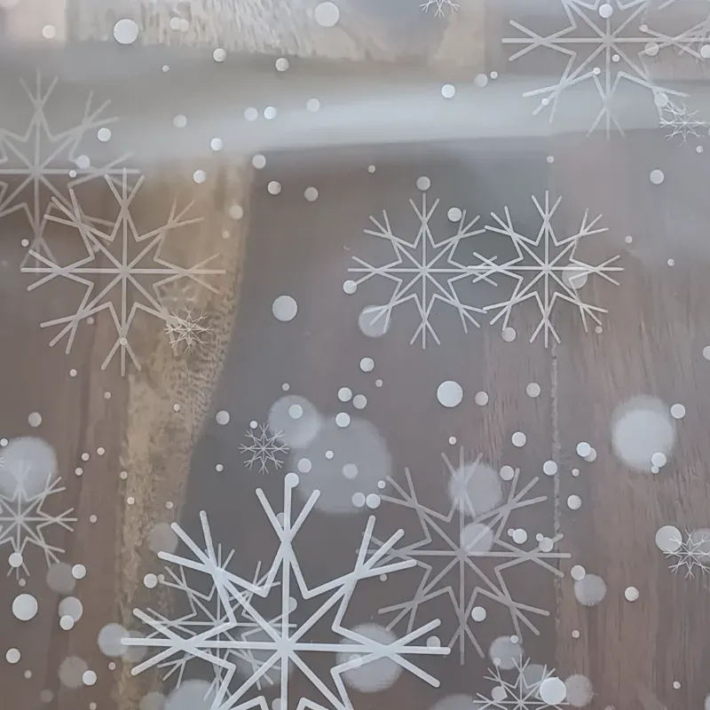 Papel coreano transparente con copos de nieve blancos