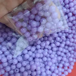 Perla morada fluorescente de 8mm 