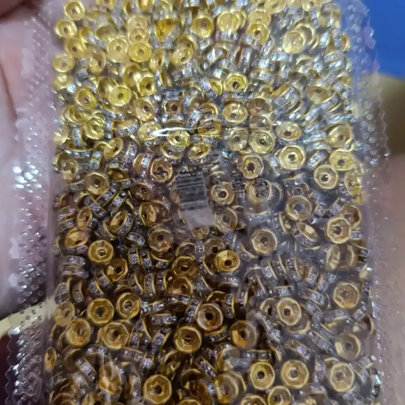 Separador o rondel de 6mm dorado con incrustaciones 