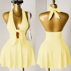 Vestido corto color amarillos lazos y abertura, escote espalda.