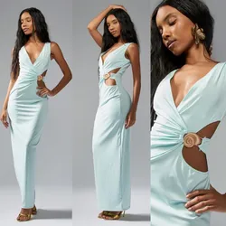 Vestido largo color verde con detalle de caracol dorado