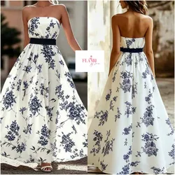 Vestido largo sin tirantes estampado de flores y ribete negro