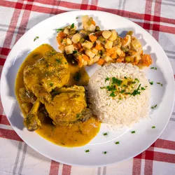 Curry Chicken Curry chicken served with rice and vegetables.