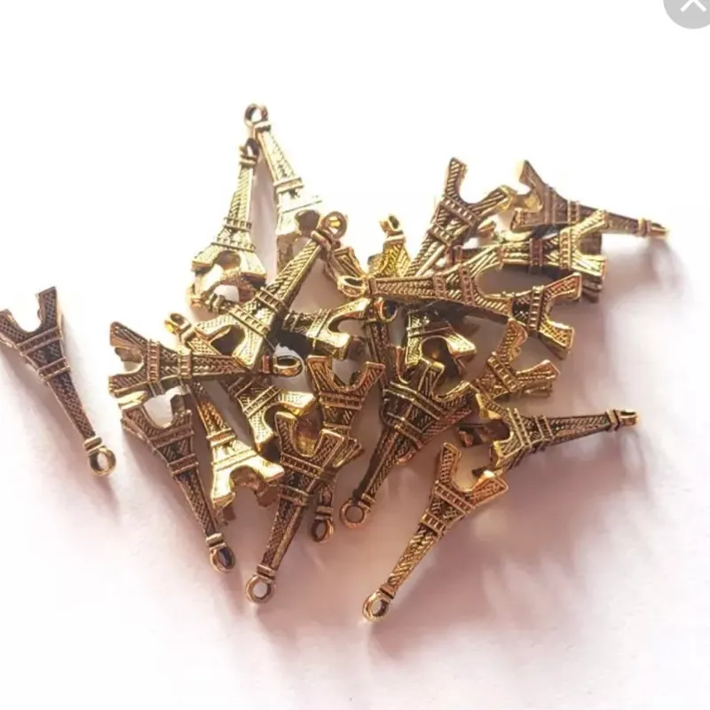 Dije de torre effeil dorado 