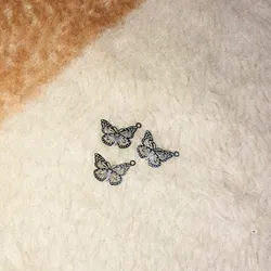 Dijes mariposa de acero inoxidable