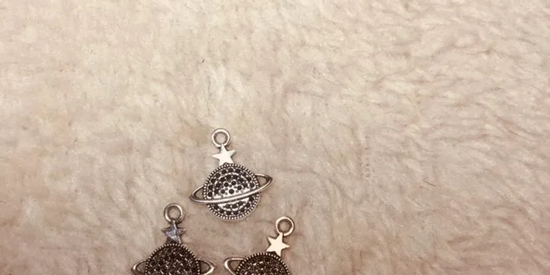 Dijes Saturnos de acero inoxidable 