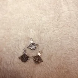 Dijes Saturnos de acero inoxidable 